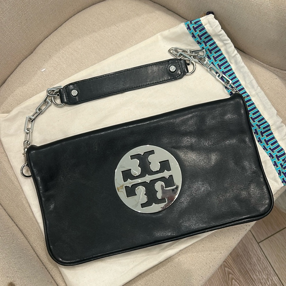 Tory Burch Logo Clutch with removable shoulder strap.